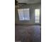 Comfortable bedroom with a ceiling fan and a door to a balcony providing views and fresh air at 7730 Secret Shore Dr # 207, Las Vegas, NV 89128