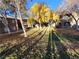 Exterior view of apartment buildings surrounded by trees during Autumn at 7730 Secret Shore Dr # 207, Las Vegas, NV 89128
