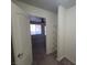 View of bedroom closet with wire shelving and entry to bedroom with a window at 7730 Secret Shore Dr # 207, Las Vegas, NV 89128