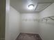 Walk-in closet features wire shelving and recessed lighting, offering ample storage space at 7730 Secret Shore Dr # 207, Las Vegas, NV 89128
