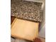 Open kitchen drawer featuring granite countertops, and light wood cabinetry at 7730 Secret Shore Dr # 207, Las Vegas, NV 89128