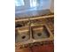 Stainless steel kitchen sink with granite countertop and matching backsplash at 7730 Secret Shore Dr # 207, Las Vegas, NV 89128