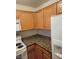 Kitchen features granite countertops, modern appliances, and light wood cabinetry at 7730 Secret Shore Dr # 207, Las Vegas, NV 89128