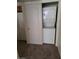 Convenient in-unit laundry area with stacked washer and dryer behind a sliding closet door at 7730 Secret Shore Dr # 207, Las Vegas, NV 89128