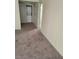 Spacious living room area with in-unit washer and dryer in the closet at 7730 Secret Shore Dr # 207, Las Vegas, NV 89128
