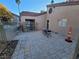 Fenced in patio with table and chairs with a pool beyond the gate at 7730 Secret Shore Dr # 207, Las Vegas, NV 89128