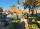 Apartment complex and common area with pool and trees at 7730 Secret Shore Dr # 207, Las Vegas, NV 89128
