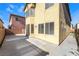 Spacious backyard with a concrete patio, sliding glass doors, and plenty of privacy at 8109 Retriever Ave, Las Vegas, NV 89147