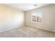 Inviting bedroom with large windows bringing in natural light and soft carpeting creating a cozy space at 8109 Retriever Ave, Las Vegas, NV 89147