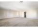 The bonus room has carpet and neutral paint and an adjacent bathroom at 8109 Retriever Ave, Las Vegas, NV 89147
