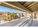 Inviting two-story townhomes with desert landscaping and private garages are captured from the balcony view at 8109 Retriever Ave, Las Vegas, NV 89147