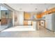 Bright eat-in kitchen boasts granite countertops and backyard access through sliding glass doors at 8109 Retriever Ave, Las Vegas, NV 89147
