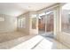 Bright living room features backyard access, tile accents, and lots of natural light at 8109 Retriever Ave, Las Vegas, NV 89147