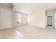 Spacious living room with neutral carpet and tile flooring, and a bright and open feel at 8109 Retriever Ave, Las Vegas, NV 89147