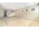 Large living room featuring plush carpeting, bright windows, and a view of the entry at 8109 Retriever Ave, Las Vegas, NV 89147