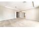 Large main bedroom with neutral carpet and paint and a view of the ensuite at 8109 Retriever Ave, Las Vegas, NV 89147