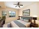 Staged bedroom with a large window, ceiling fan, and neutral decor at 8255 Las Vegas Blvd # 117, Las Vegas, NV 89123