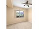 Bright bedroom with neutral carpet and a large window at 8255 Las Vegas Blvd # 117, Las Vegas, NV 89123