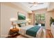 Stylishly staged bedroom with a comfortable bed and access to a private balcony at 8255 Las Vegas Blvd # 117, Las Vegas, NV 89123