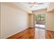 Bedroom with hardwood floors and sliding glass doors leading to a balcony at 8255 Las Vegas Blvd # 117, Las Vegas, NV 89123