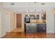Open-concept kitchen featuring a breakfast bar, granite countertops and stainless appliances at 8255 Las Vegas Blvd # 117, Las Vegas, NV 89123