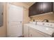 Functional laundry room featuring washer, dryer, and storage at 8255 Las Vegas Blvd # 117, Las Vegas, NV 89123