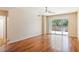 Bright living room with hardwood floors and access to a private balcony at 8255 Las Vegas Blvd # 117, Las Vegas, NV 89123