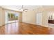 Spacious living room with hardwood floors and sliding glass doors leading to a balcony at 8255 Las Vegas Blvd # 117, Las Vegas, NV 89123