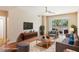 Comfortable living room with a stylish couch, hardwood floors, and sliding glass doors to a patio at 8255 Las Vegas Blvd # 117, Las Vegas, NV 89123