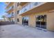 Spacious patio featuring sliding glass doors and building balconies at 8255 Las Vegas Blvd # 117, Las Vegas, NV 89123