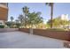Large patio featuring mature landscaping and block wall at 8255 Las Vegas Blvd # 117, Las Vegas, NV 89123