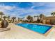 Large swimming pool with lounge chairs and a beautiful blue sky at 8255 Las Vegas Blvd # 117, Las Vegas, NV 89123