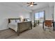 Bright bedroom featuring two beds, a ceiling fan, and a window with city views for comfortable living at 8255 Las Vegas Blvd Blvd # 719, Las Vegas, NV 89123