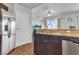 Kitchen area with stainless steel fridge, sink with granite countertop, and hardwood floors at 8255 Las Vegas Blvd Blvd # 719, Las Vegas, NV 89123