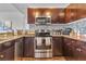 Gourmet kitchen featuring stainless appliances, granite countertops, and designer backsplash at 8255 Las Vegas Blvd Blvd # 719, Las Vegas, NV 89123