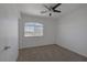 Bedroom featuring carpet flooring and a large window at 829 Dancing Vines Ave, Las Vegas, NV 89183