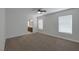 Spacious bedroom featuring a ceiling fan, window, and ensuite bathroom at 829 Dancing Vines Ave, Las Vegas, NV 89183