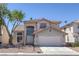 Charming two-story home featuring desert landscaping and a tile roof at 829 Dancing Vines Ave, Las Vegas, NV 89183