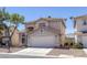 Charming two-story home featuring desert landscaping and a tile roof at 829 Dancing Vines Ave, Las Vegas, NV 89183