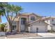 Charming two-story home featuring desert landscaping and a tile roof at 829 Dancing Vines Ave, Las Vegas, NV 89183