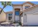 Inviting two-story home featuring manicured desert landscaping and a two car garage at 829 Dancing Vines Ave, Las Vegas, NV 89183