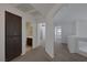 Hallway view with carpet flooring, a linen closet, and access to multiple bedrooms at 829 Dancing Vines Ave, Las Vegas, NV 89183