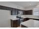 Bright kitchen featuring modern stainless steel appliances, ample cabinet space, and tile countertops at 829 Dancing Vines Ave, Las Vegas, NV 89183