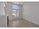 Spacious living room featuring tile flooring and a large window at 829 Dancing Vines Ave, Las Vegas, NV 89183
