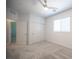 Bright bedroom with plush carpet, a ceiling fan, and ample closet space at 871 Aurelie Ridge St, Henderson, NV 89011