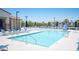 A pristine community pool with lounge chairs and umbrellas for residents' enjoyment at 871 Aurelie Ridge St, Henderson, NV 89011