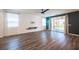 Spacious living room with wood-look floors and access to backyard at 871 Aurelie Ridge St, Henderson, NV 89011