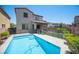 A refreshing swimming pool in a fenced backyard of a modern two-story home at 871 Aurelie Ridge St, Henderson, NV 89011