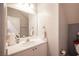 Bathroom with a white countertop sink, vanity, and standard toilet at 9322 Straw Hays St # 103, Las Vegas, NV 89178