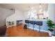 Stylish breakfast bar with modern stools and views to the staircase at 9322 Straw Hays St # 103, Las Vegas, NV 89178